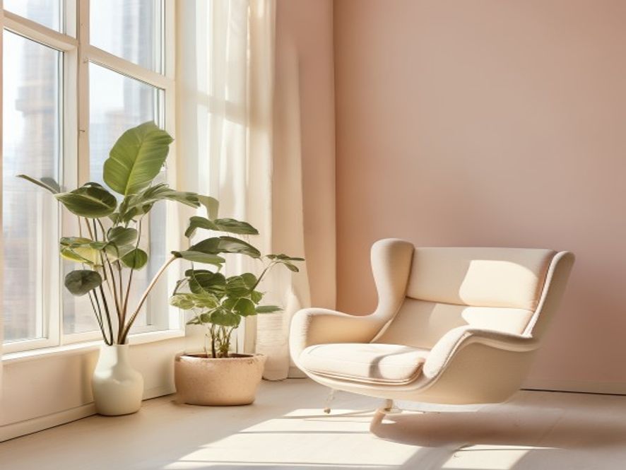 Person at desk taking a mindful pause near window with natural light visible